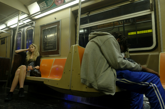 A passenger sleeps on a night service metro train in the Brooklyn borough of New York City, U.S.
